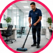 Pro Shine team member vacuuming an office floor